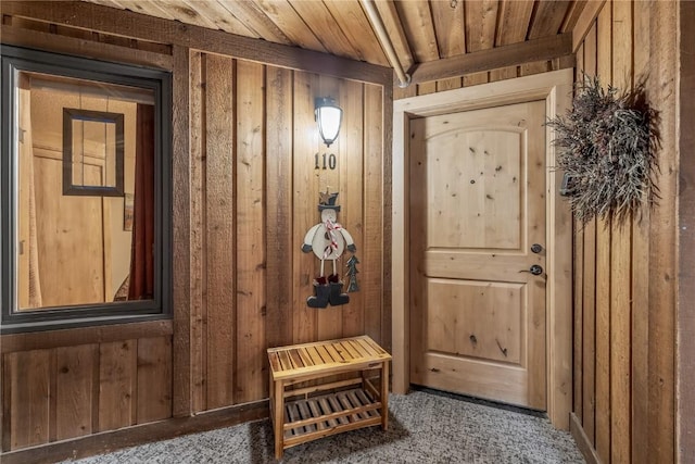 530 S French St Unit 110, Breckenridge, CO 80424 - doorway with wooden walls, wooden ceiling, and carpet