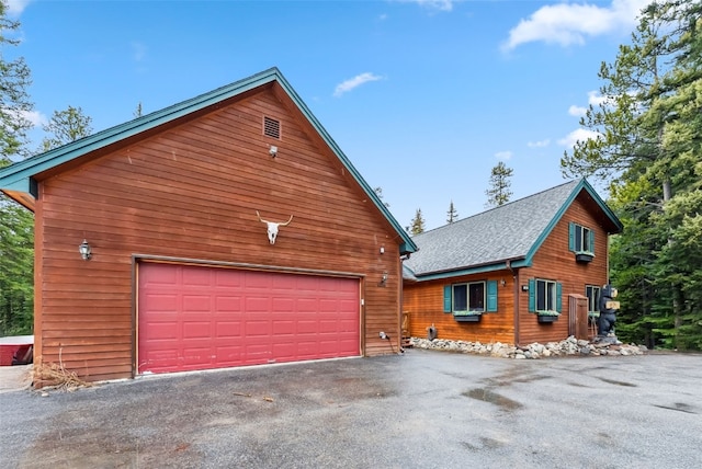 285 Davis Ct, Blue River, CO 80424 - view of front of house with roof with shingles and a garage