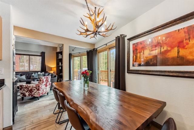 285 Davis Ct, Blue River, CO 80424 - dining room featuring a chandelier and light wood-style flooring