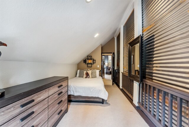 285 Davis Ct, Blue River, CO 80424 - bedroom with vaulted ceiling and light colored carpet