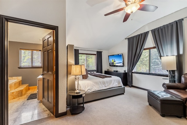285 Davis Ct, Blue River, CO 80424 - bedroom with baseboards, light colored carpet, vaulted ceiling, ceiling fan, and connected bathroom
