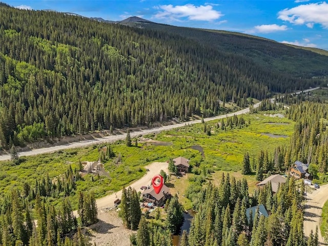 136 Lance Ln Unit 2, Breckenridge, CO 80424 - aerial view of property and surrounding area featuring a forest and mountains