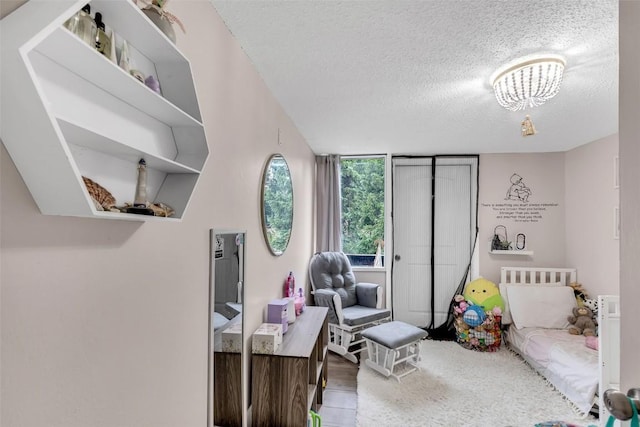 136 Lance Ln Unit 2, Breckenridge, CO 80424 - bedroom with a textured ceiling and wood finished floors