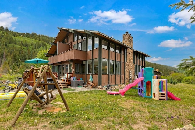 136 Lance Ln Unit 2, Breckenridge, CO 80424 - view of play area with a forest view and a yard