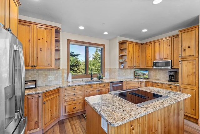 2743 Timber Ct Unit 3, Steamboat Springs, CO 80487 - kitchen featuring stainless steel appliances, open shelves, a sink, light wood finished floors, and recessed lighting