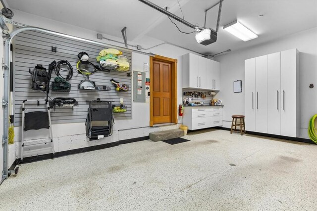 2743 Timber Ct Unit 3, Steamboat Springs, CO 80487 - garage featuring a garage door opener and electric panel