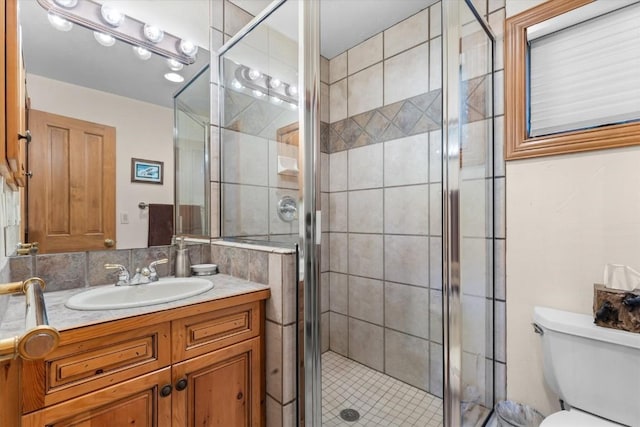 2743 Timber Ct Unit 3, Steamboat Springs, CO 80487 - bathroom featuring vanity, toilet, and a stall shower