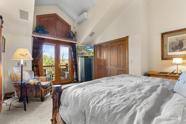 2743 Timber Ct Unit 3, Steamboat Springs, CO 80487 - carpeted bedroom featuring access to outside, high vaulted ceiling, an AC wall unit, and a closet