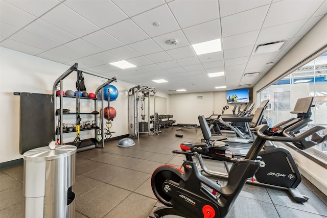405 Village Rd Unit 405, Breckenridge, CO 80424 - exercise room with baseboards and a paneled ceiling