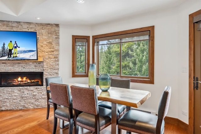 405 Village Rd Unit 405, Breckenridge, CO 80424 - dining space with wood finished floors, a fireplace, and recessed lighting