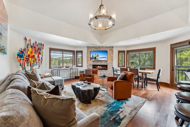 405 Village Rd Unit 405, Breckenridge, CO 80424 - living room featuring wood finished floors, a chandelier, recessed lighting, and a fireplace