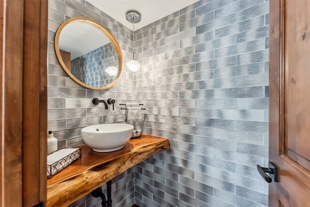 405 Village Rd Unit 405, Breckenridge, CO 80424 - bathroom featuring a sink and tile walls