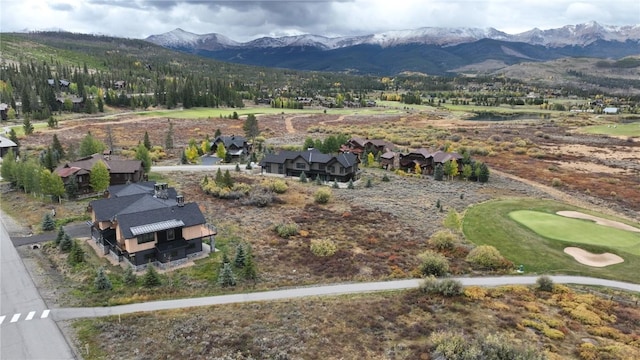 bird's eye view featuring a mountain view, golf course view, and a residential view