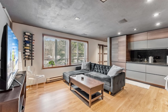 344 Illinois Gulch Rd Unit 201, Breckenridge, CO 80424 - living area with a baseboard radiator, light wood-type flooring, recessed lighting, and baseboards