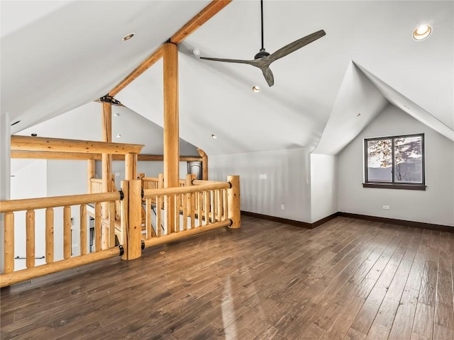 additional living space with baseboards, vaulted ceiling, hardwood / wood-style flooring, and ceiling fan