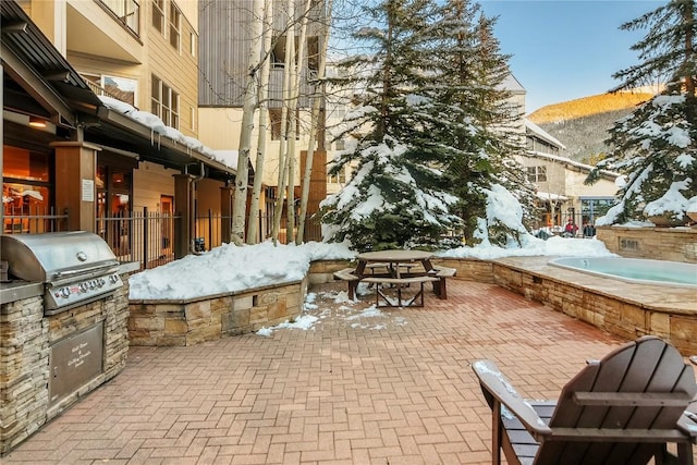 140 Ida Belle Dr Unit 8294, Dillon, CO 80435 - snow covered patio with area for grilling, a patio area, and a mountain view