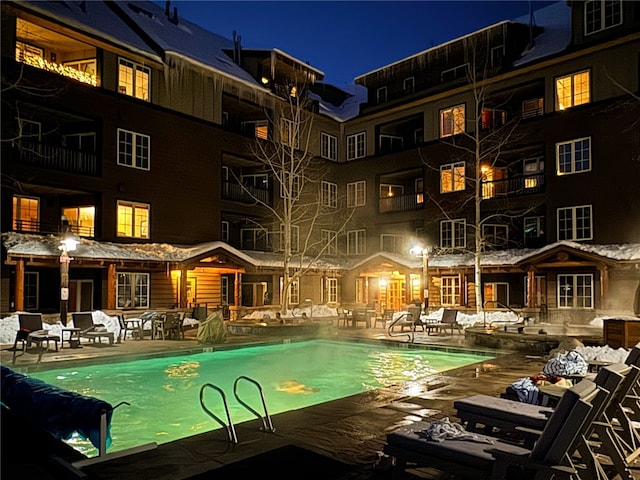 140 Ida Belle Dr Unit 8294, Dillon, CO 80435 - pool at twilight featuring a community pool and a patio
