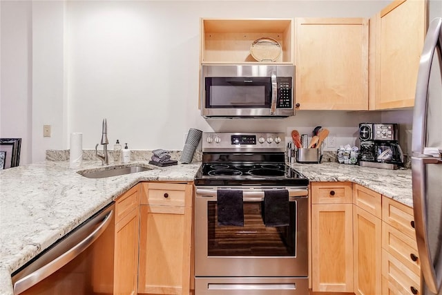140 Ida Belle Dr Unit 8294, Dillon, CO 80435 - kitchen with stainless steel appliances, light brown cabinetry, and light stone countertops