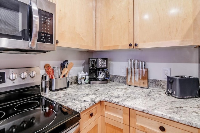 140 Ida Belle Dr Unit 8294, Dillon, CO 80435 - kitchen featuring electric stove, stainless steel microwave, light brown cabinetry, and light stone counters