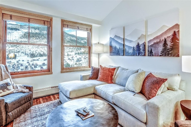 140 Ida Belle Dr Unit 8294, Dillon, CO 80435 - living area with a baseboard radiator, lofted ceiling, and wood finished floors