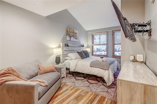 140 Ida Belle Dr Unit 8294, Dillon, CO 80435 - bedroom with light wood-type flooring and vaulted ceiling