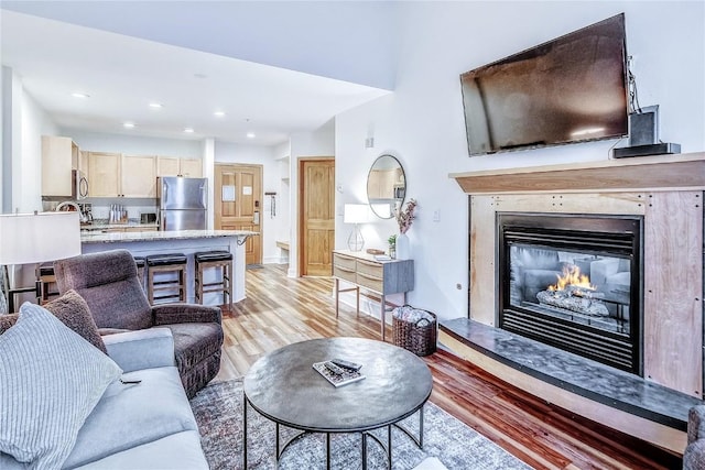140 Ida Belle Dr Unit 8294, Dillon, CO 80435 - living area featuring light wood-style floors, a glass covered fireplace, and recessed lighting