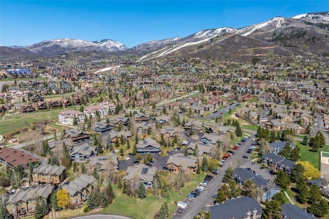 birds eye view of property with a mountain view and a residential view