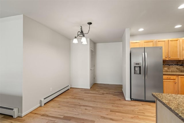 kitchen with light wood-style floors, stainless steel fridge with ice dispenser, baseboard heating, and recessed lighting