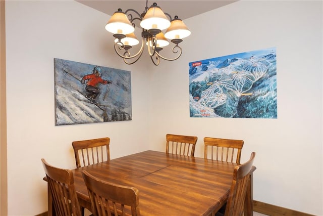1207 W Keystone Rd Unit 2703, Keystone, CO 80435 - dining space featuring a chandelier and baseboards