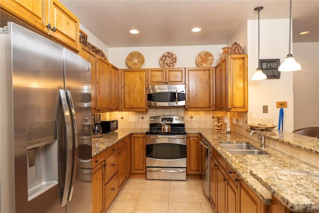 1207 W Keystone Rd Unit 2703, Keystone, CO 80435 - kitchen with stainless steel appliances, brown cabinets, backsplash, light stone counters, and recessed lighting