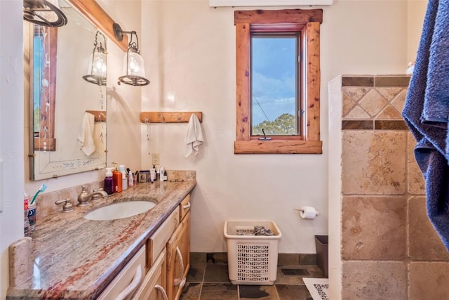 76 County Road 60b, Maybell, CO 81640 - bathroom with vanity, baseboards, and stone finish flooring