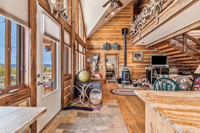 76 County Road 60b, Maybell, CO 81640 - foyer with a wood stove, a towering ceiling, and light wood-style flooring