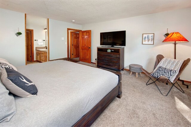 21620 US Highway 6 Unit 2152, Keystone, CO 80435 - carpeted bedroom featuring a textured ceiling and connected bathroom
