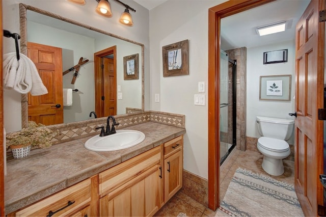 21620 US Highway 6 Unit 2152, Keystone, CO 80435 - bathroom with toilet, tile patterned floors, vanity, and a stall shower