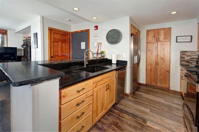 21620 US Highway 6 Unit 2152, Keystone, CO 80435 - kitchen with a sink, appliances with stainless steel finishes, dark wood finished floors, a peninsula, and recessed lighting