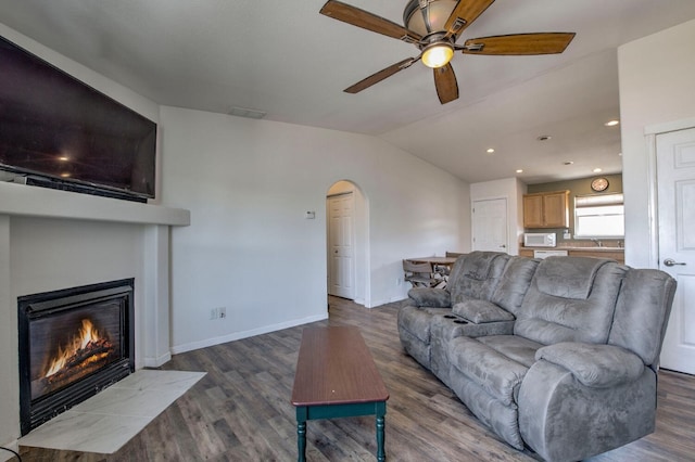 316 Stone Creek Dr, Fairplay, CO 80440 - living room featuring ceiling fan, arched walkways, lofted ceiling, and wood finished floors