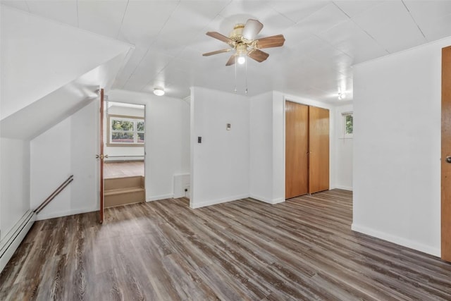 186 E Jefferson Ave, Hayden, CO 81639 - bonus room featuring wood finished floors, a baseboard heating unit, and a ceiling fan