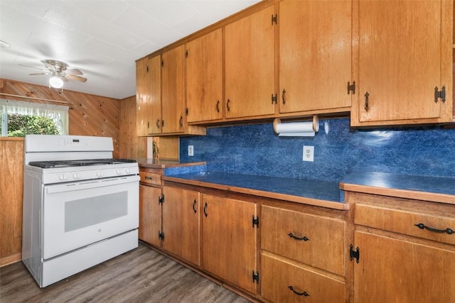 186 E Jefferson Ave, Hayden, CO 81639 - kitchen featuring white gas range, a ceiling fan, backsplash, and wood finished floors