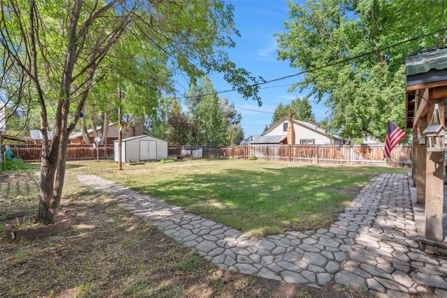 186 E Jefferson Ave, Hayden, CO 81639 - fenced backyard with a storage shed and a patio