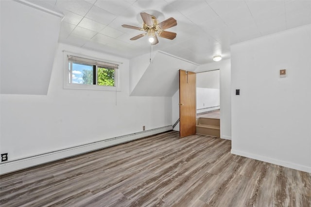 186 E Jefferson Ave, Hayden, CO 81639 - additional living space featuring baseboard heating, wood finished floors, a baseboard heating unit, a ceiling fan, and lofted ceiling