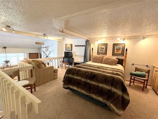 1920 Ski Time Square Dr Unit 208, Steamboat Springs, CO 80487 - bedroom featuring light colored carpet, a textured ceiling, and a ceiling fan