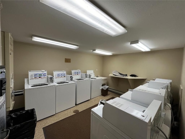 1920 Ski Time Square Dr Unit 208, Steamboat Springs, CO 80487 - communal laundry room with separate washer and dryer and baseboard heating