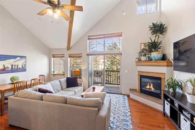700 Lakepoint Dr Unit A10, Frisco, CO 80443 - living area featuring a ceiling fan, high vaulted ceiling, a glass covered fireplace, and a healthy amount of sunlight