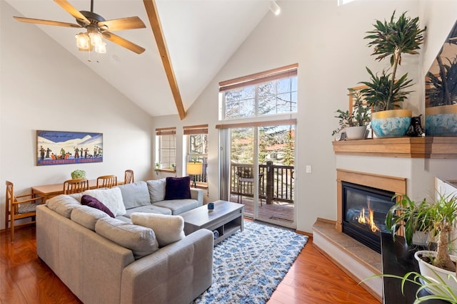 700 Lakepoint Dr Unit A10, Frisco, CO 80443 - living room with a ceiling fan, a glass covered fireplace, wood finished floors, and high vaulted ceiling