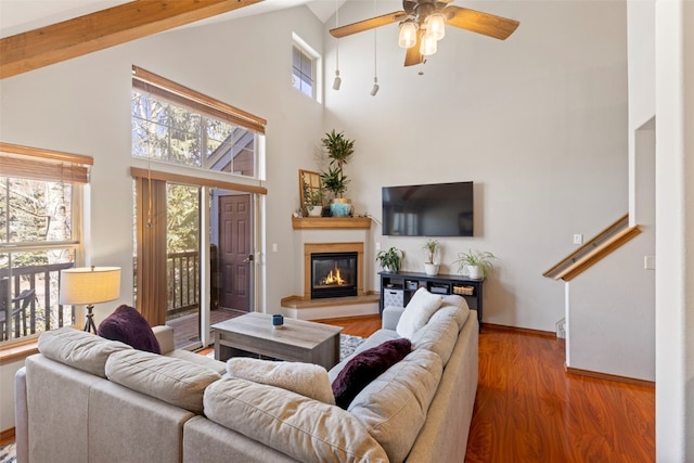 700 Lakepoint Dr Unit A10, Frisco, CO 80443 - living room featuring high vaulted ceiling, ceiling fan, a glass covered fireplace, and a healthy amount of sunlight