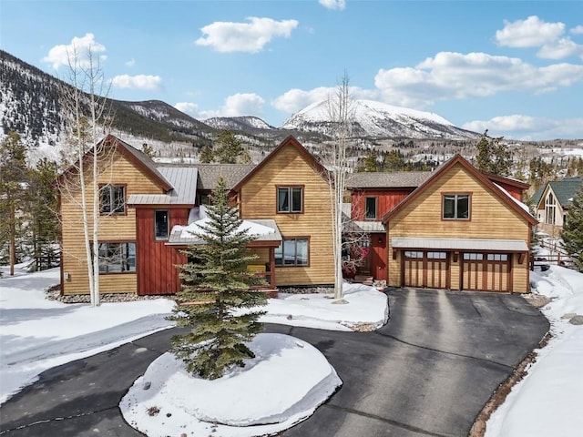 223 County Road 1041, Frisco, CO 80443 - rustic home featuring a garage, aphalt driveway, and a mountain view