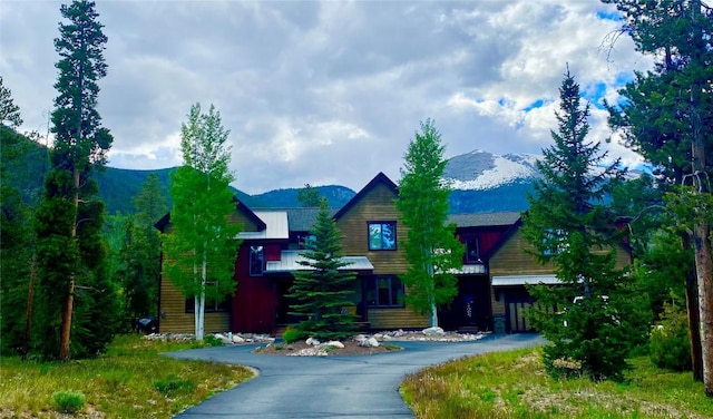view of front of property featuring a mountain view and aphalt driveway