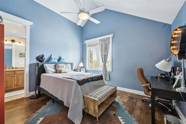 bedroom with a ceiling fan, wood finished floors, baseboards, connected bathroom, and lofted ceiling