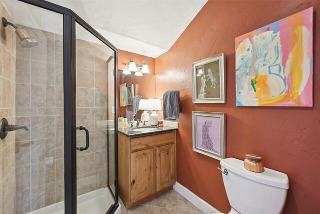 223 County Road 1041, Frisco, CO 80443 - bedroom with a ceiling fan, wood finished floors, baseboards, connected bathroom, and lofted ceiling
