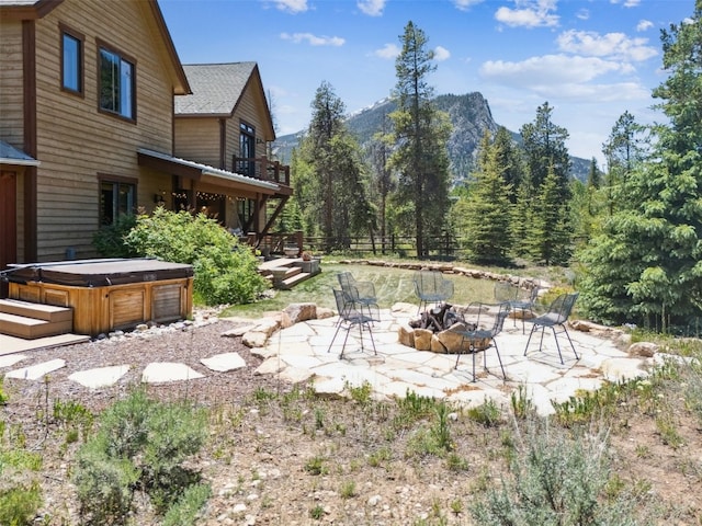 223 County Road 1041, Frisco, CO 80443 - view of yard featuring a fire pit, a hot tub, a patio, and a mountain view